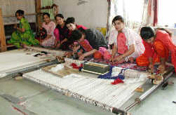 Our weavers work diligently at their masterpieces!