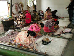 Our weavers work diligently at their masterpieces!